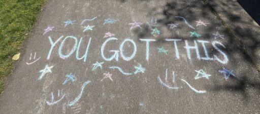 Chalk drawing on pavement with the message "YOU GOT THIS" surrounded by stars, smiley faces, and swirl designs reflects UPrep's commitment to student wellness.
