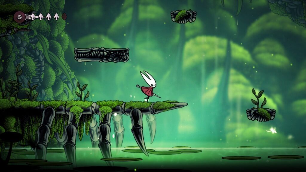 A white, bug-like character in a red cloak stands on a mossy ledge in a lush platform video game world, reminiscent of the vibrant indie titles often showcased at PAX West, Seattle’s premier gaming convention.