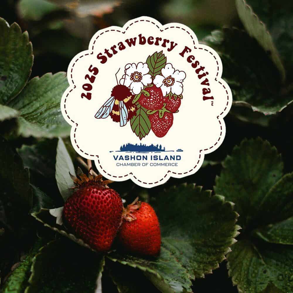 Must List: Sticker for the 2025 Strawberry Festival on Vashon Island, dated 07-17-2025, is placed over strawberry plants, with two ripe strawberries visible among green leaves.